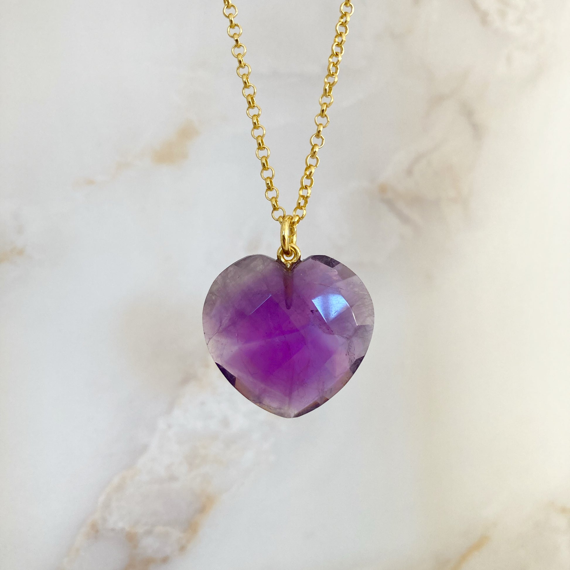Amethyst crystal heart pendant with gold plated chain